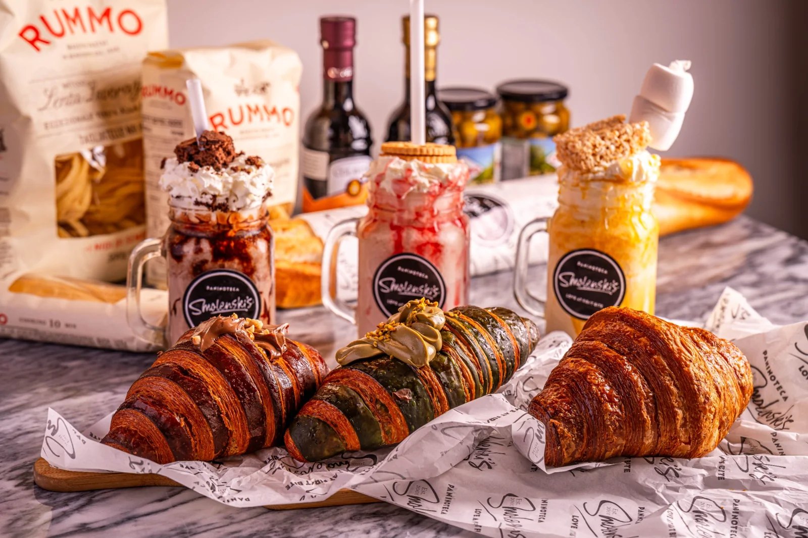 Fresh croissants with chocolate and pistachio toppings at Smolenski’s
